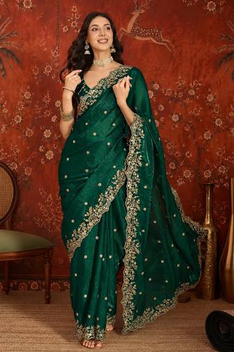 Bottle green tissue satin embroidered saree with unstitched blouse piece.