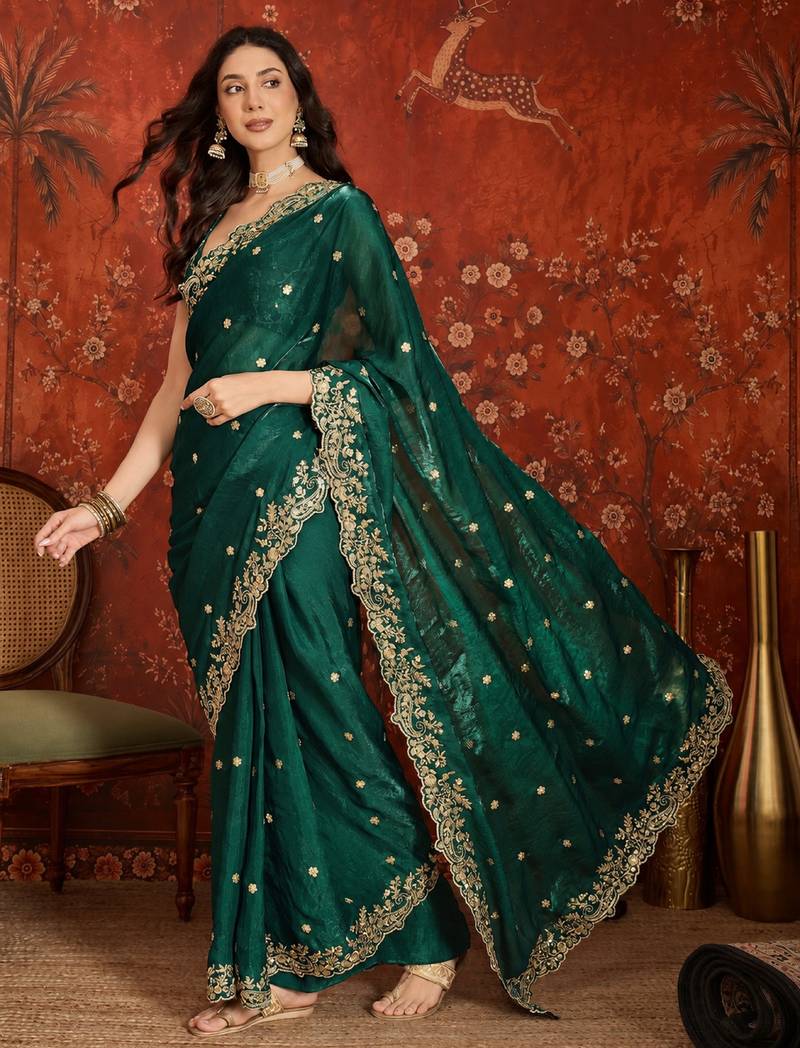 Bottle green tissue satin embroidered saree with unstitched blouse piece.