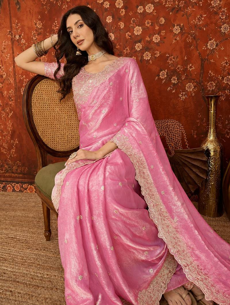 Pink tissue satin embroidered saree with unstitched blouse piece.