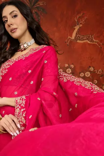 Rani tissue satin embroidered saree with unstitched blouse piece.