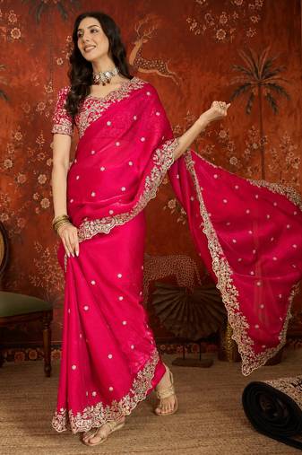 Rani tissue satin embroidered saree with unstitched blouse piece.