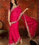 Rani tissue satin embroidered saree with unstitched blouse piece.