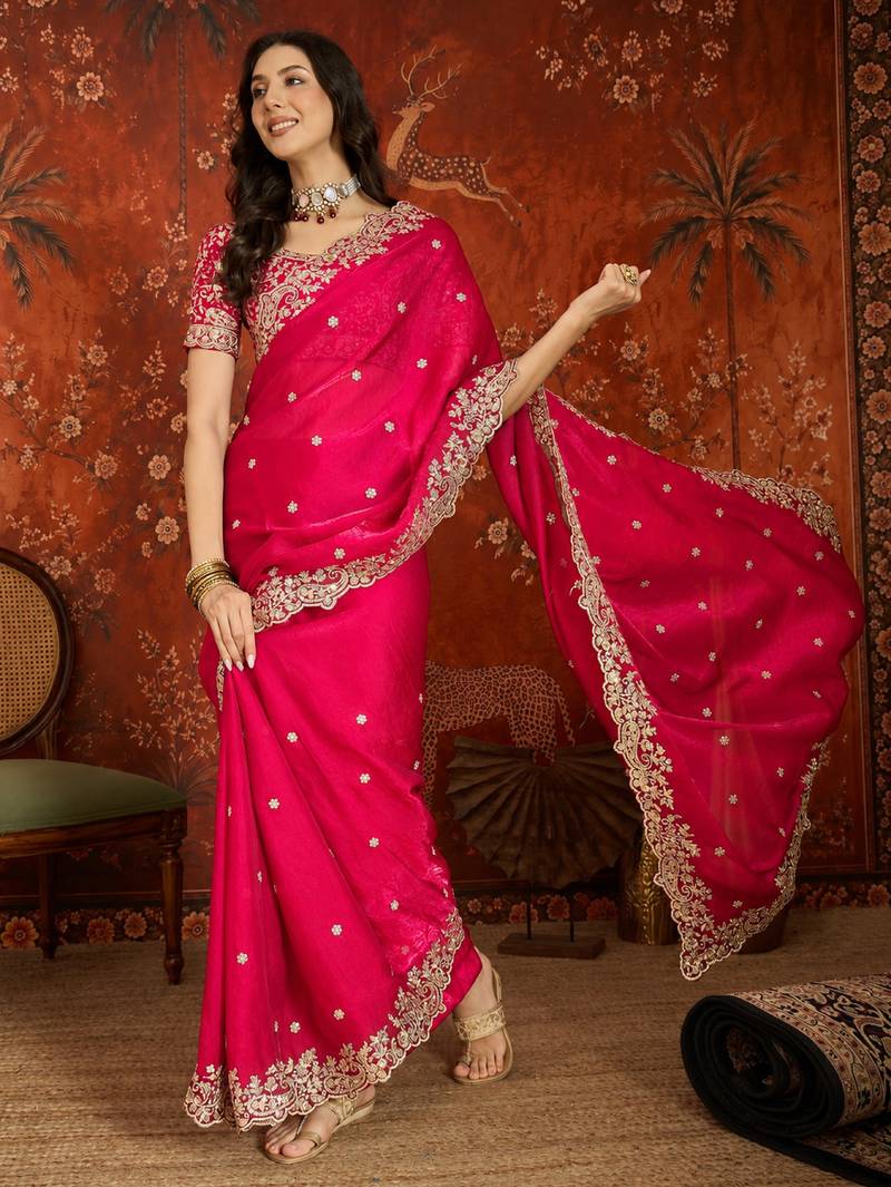 Rani tissue satin embroidered saree with unstitched blouse piece.