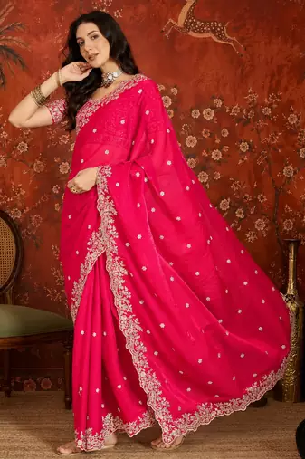 Rani tissue satin embroidered saree with unstitched blouse piece.
