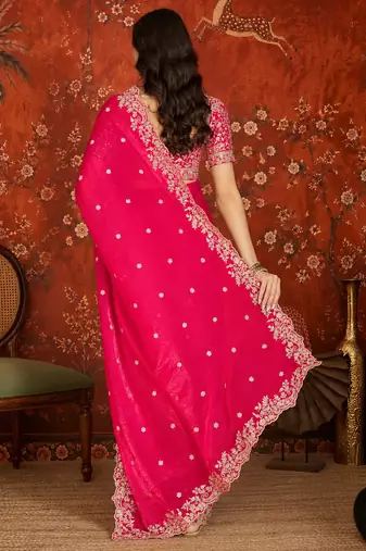 Rani tissue satin embroidered saree with unstitched blouse piece.