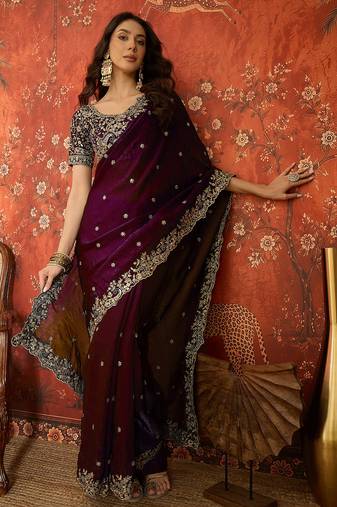 Wine tissue satin embroidered saree with unstitched blouse piece.