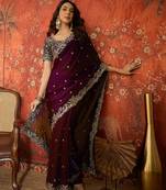 Wine tissue satin embroidered saree with unstitched blouse piece.