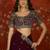 Wine tissue satin embroidered saree with unstitched blouse piece.