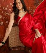 Red tissue satin embrellished saree with unstitched blouse piece.