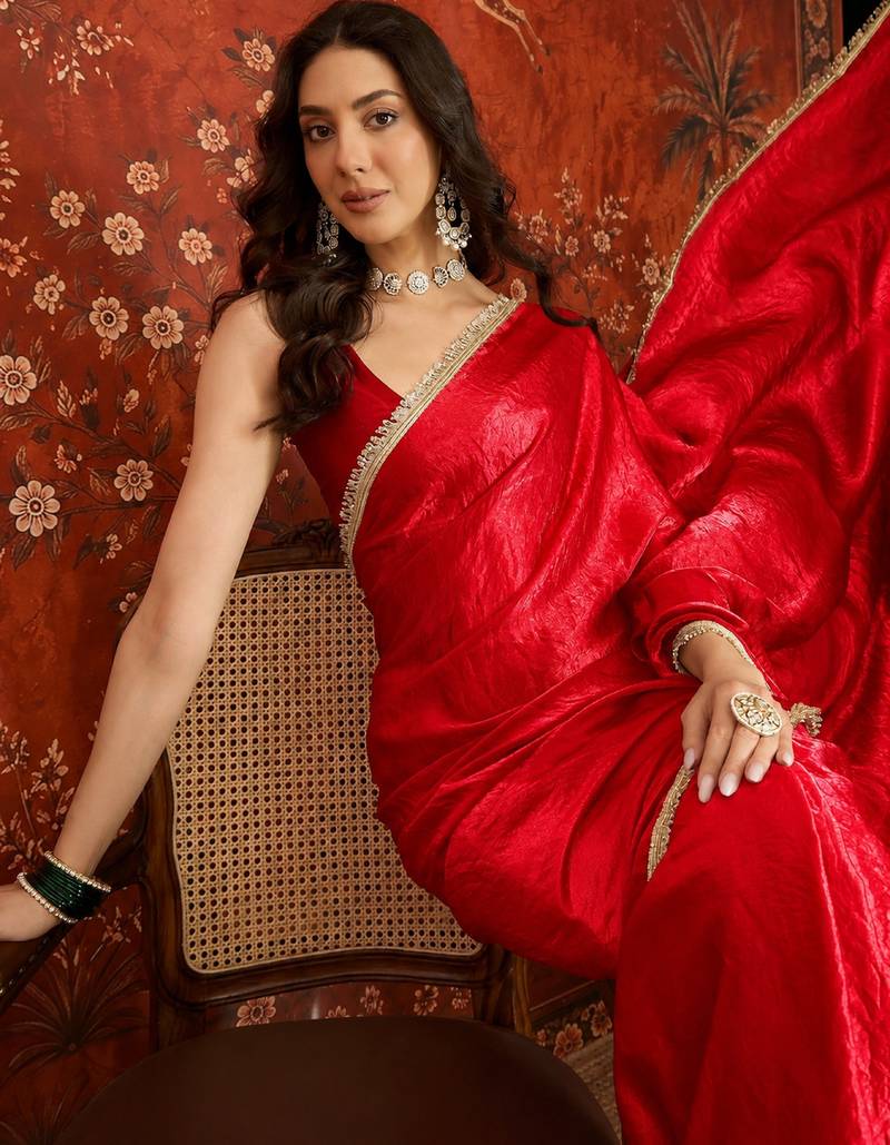 Red tissue satin embrellished saree with unstitched blouse piece.