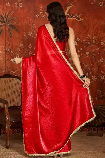 Red tissue satin embrellished saree with unstitched blouse piece.