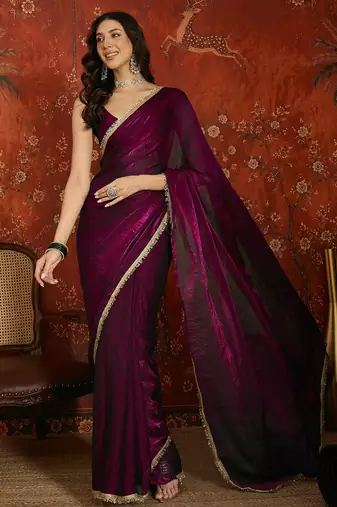 Wine tissue satin embrellished saree with unstitched blouse piece.