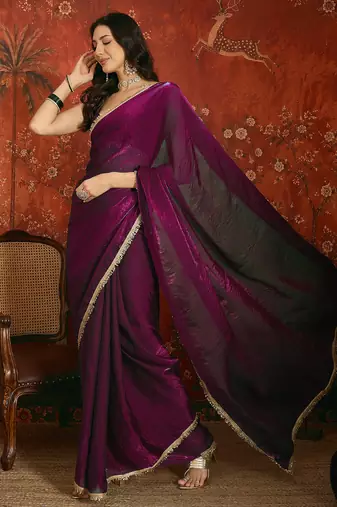 Wine tissue satin embrellished saree with unstitched blouse piece.