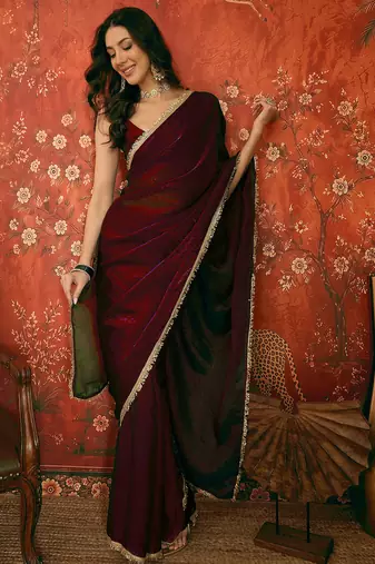 Wine tissue satin embrellished saree with unstitched blouse piece.