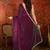 Wine tissue satin embrellished saree with unstitched blouse piece.
