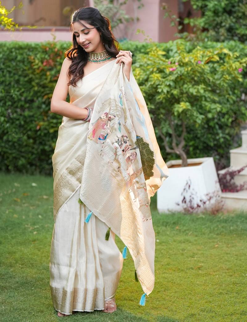 uma pure tissue viscose with zari weaving around borders & pallu radha rani art work with thread around pallu