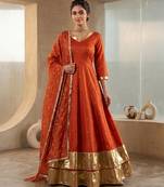 Rust orange silk anarkali suit with golden border and embroidered dupatta