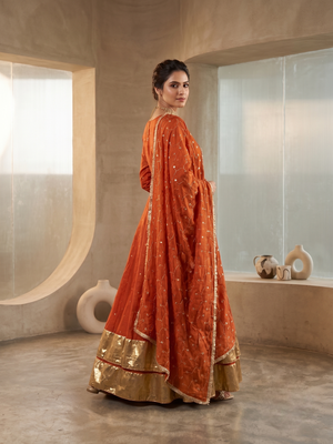 Rust orange silk anarkali suit with golden border and embroidered dupatta 2