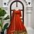 Rust orange silk anarkali suit with golden border and embroidered dupatta