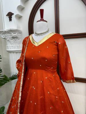 Rust orange silk anarkali suit with golden border and embroidered dupatta 4