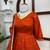 Rust orange silk anarkali suit with golden border and embroidered dupatta