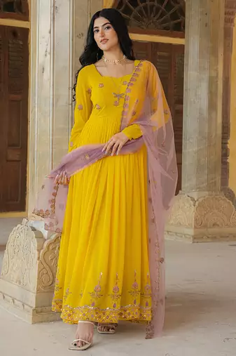 Radiant yellow georgette gown with lilac soft net dupatta & embroidery