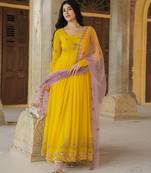 Radiant yellow georgette gown with lilac soft net dupatta & embroidery