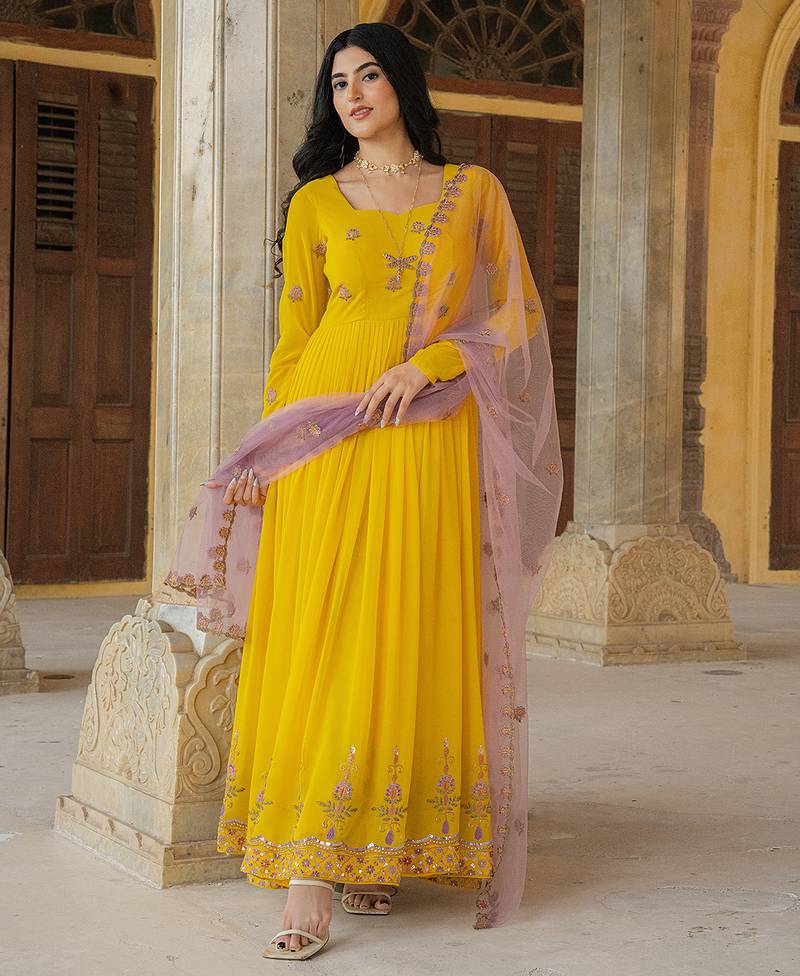 Radiant yellow georgette gown with lilac soft net dupatta & embroidery