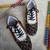 Red and black printed artificial leather sneakers