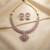 Delicate soft pink color american diamond necklace set for modern wedding guests