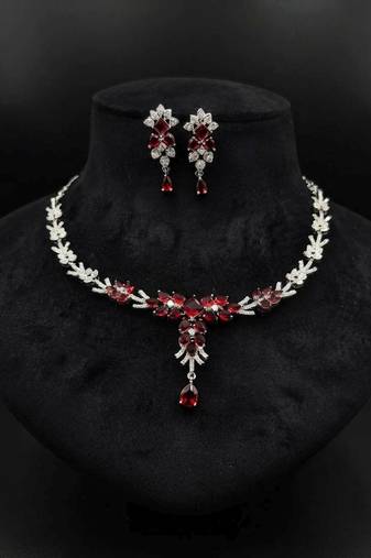 Striking blood red color american diamond necklace set for grand bridal attire