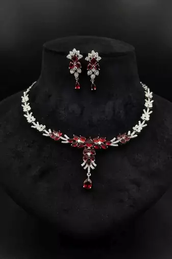 Striking blood red color american diamond necklace set for grand bridal attire