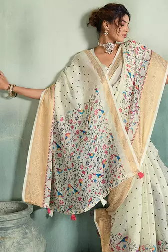 White color linen fabric graceful festive looks fancy saree