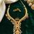 gold plated pearl necklace set with ruby and emerald accents