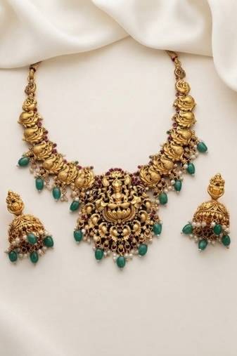 antique gold lakshmi temple necklace set with emerald green stones