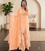 Pastel pink heavy zari work short kurti with flared sharara & dupatta