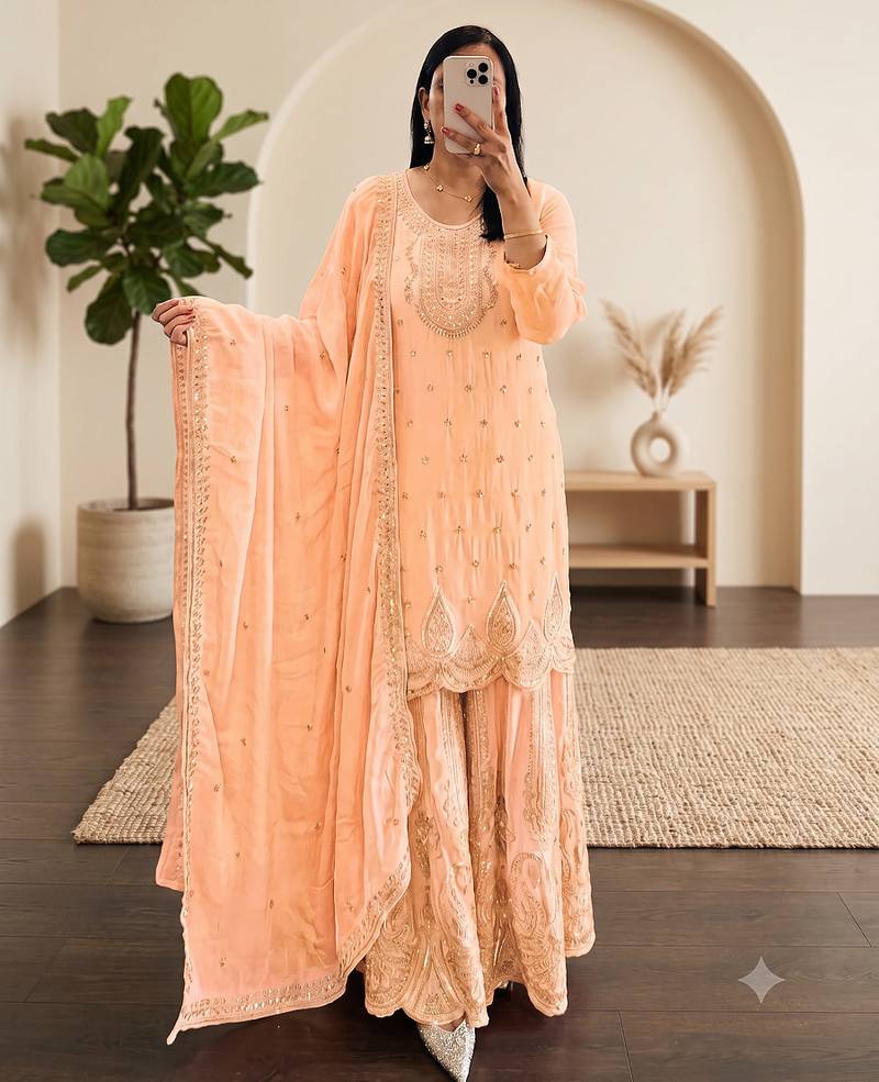 Pastel pink heavy zari work short kurti with flared sharara & dupatta