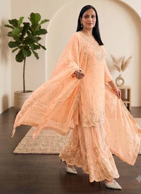 Pastel pink heavy zari work short kurti with flared sharara & dupatta 3