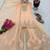 Pastel pink heavy zari work short kurti with flared sharara & dupatta