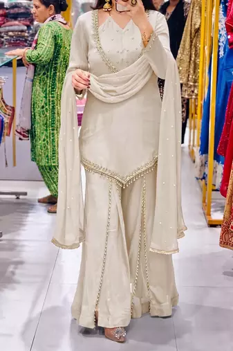 Off-white embroidered short kurti with flared pants & mirror-work dupatta set