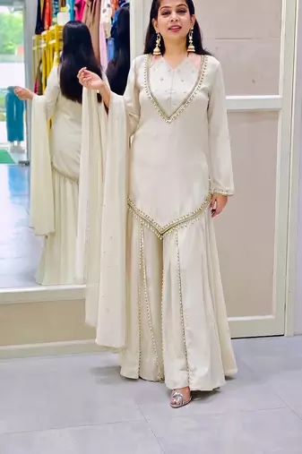 Off-white embroidered short kurti with flared pants & mirror-work dupatta set