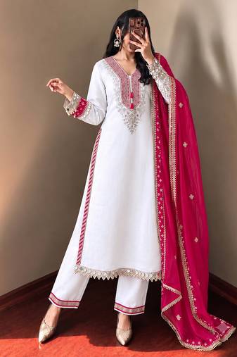 White heavy embroidered kurti pant set with contrast rani pink silk dupatta