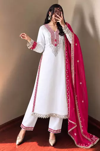 White heavy embroidered kurti pant set with contrast rani pink silk dupatta