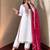 White heavy embroidered kurti pant set with contrast rani pink silk dupatta
