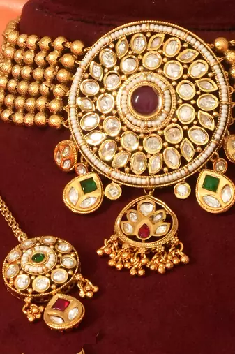 Gold plated royal kundan bridal necklace set with maang tikka