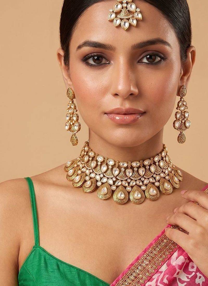Gold plated kundan semi bridal choker set with maang tikka