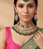 Emerald green kundan bridal choker set with maang tikka
