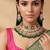 Emerald green kundan bridal choker set with maang tikka
