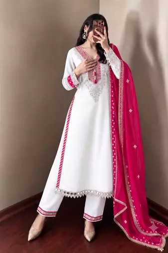 White heavy embroidered kurti pant set with contrast rani pink silk dupatta