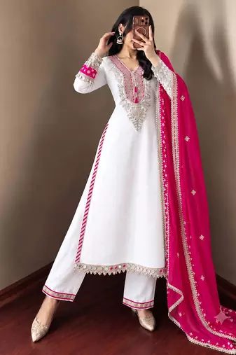 White heavy embroidered kurti pant set with contrast rani pink silk dupatta